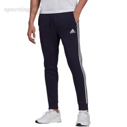 Spodnie męskie adidas Essentials Fleece Tapered Cuff 3-Band Pants granatowe GK8823 Adidas