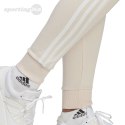 Spodnie damskie adidas Essentials 3-Stripes French Terry Cuffed kremowe IC9924 Adidas
